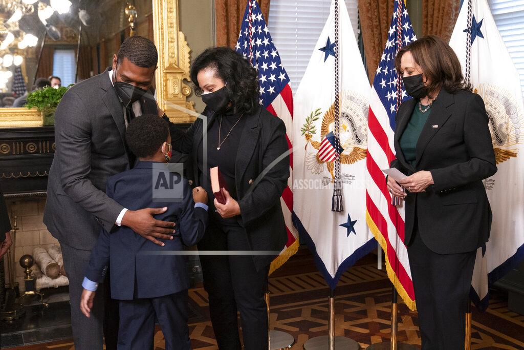 Manuel Balce Ceneta Vice President Kamala Harris, right, watches EPA administrator Michael Regan gives his wife Melvina Thomas Regan and son Matthew Silas, 7 a hug, during a ceremonial swearing-in ceremony in the Vice President's Ceremonial Office at the Eisenhower Executive Office Building on the White House complex in Washington, Wednesday, March 17, 2021. (AP Photo/Manuel Balce Ceneta)