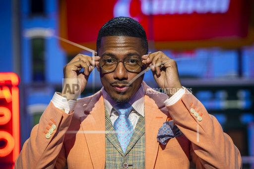 Talk show host Nick Cannon poses for a portrait on the set of "Nick Cannon" at Metropolitan Studios in New York on Sept. 16, 2021. His nationally syndicated daytime talk show premieres Sept. 27 on Fox Television Stations. (Photo by Andy Kropa/Invision/AP)