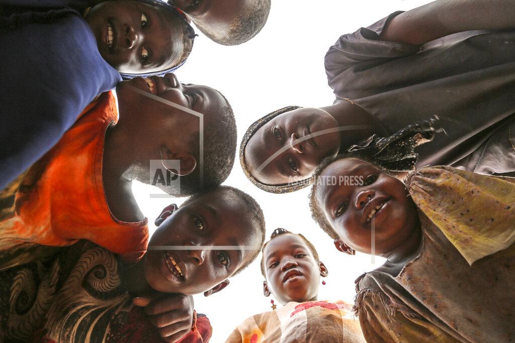 Farah Abdi Warsameh Somali children who fled drought-stricken areas play together at a makeshift camp for the displaced on the outskirts of Mogadishu, Somalia Wednesday, June 29, 2022. The war in Ukraine has abruptly drawn millions of dollars away from longer-running humanitarian crises and Somalia is perhaps the most vulnerable as thousands die of hunger amid the driest drought in decades. (AP Photo/Farah Abdi Warsameh)