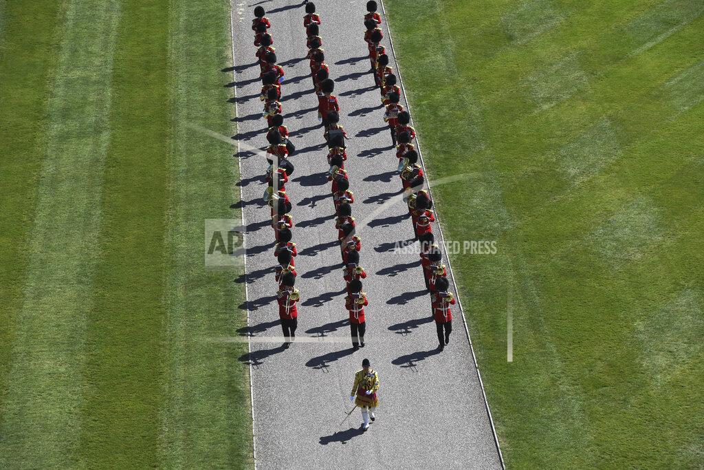 Kirsty O'connor Members of a military band march into the Quadrangle at Windsor Castle in Windsor, England Saturday, April 17, 2021 ahead of the funeral of Britain's Prince Philip. Prince Philip died April 9 at the age of 99 after 73 years of marriage to Britain's Queen Elizabeth II.(Kirsty O'Connor/Pool via AP)