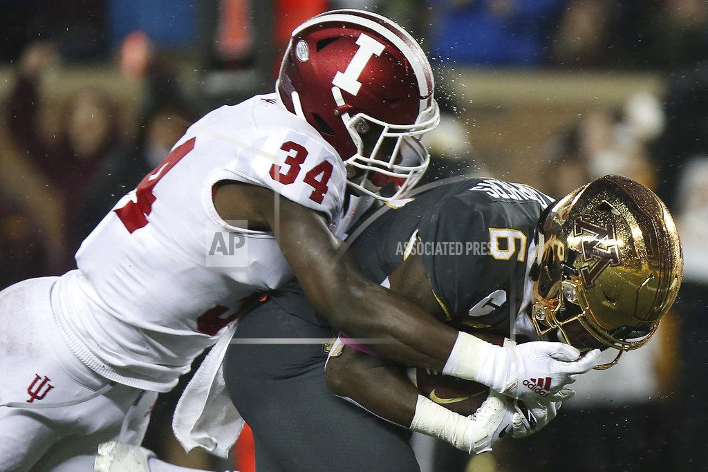 Stacy Bengs Indiana's Cam Jones tries to tackle Minnesota wide receiver Tyler Johnson during an NCAA college football game Friday, Oct. 26, 2018, in Minneapolis. (AP Photo/Stacy Bengs)