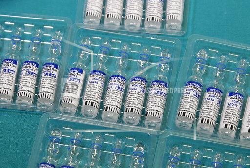 FILE - In this Friday, April 9, 2021 file photo, vials containing Russia's Sputnik V vaccine for COVID-19 are seen at the San Marino State Hospital, in San Marino. The South African drug regulator has rejected the Russian-made coronavirus vaccine Sputnik V, citing some safety concerns the manufacturer wasn't able to answer. In a statement on Tuesday, Oct. 19, 2021 the country's regulator, also known as SAHPRA, said the request for Sputnik V to be authorized could “not be approved at this time,” referring to past failed HIV vaccines that used a similar technology. (AP Photo/Antonio Calanni, File)
