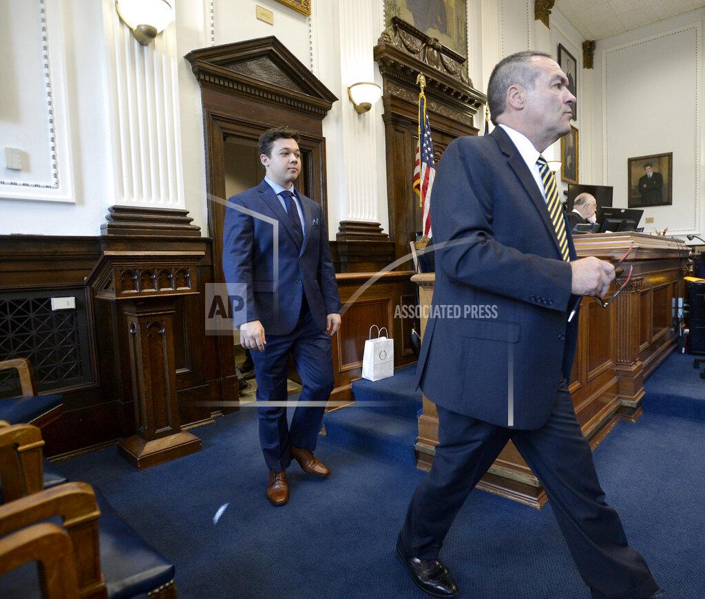 Sean Krajacic Kyle Rittenhouse, left, walks into the courtroom with attorney Mark Richards for a motion hearing in Kenosha, Wis., on Friday, Sept. 17, 2021. (Sean Krajacic/The Kenosha News via AP)
