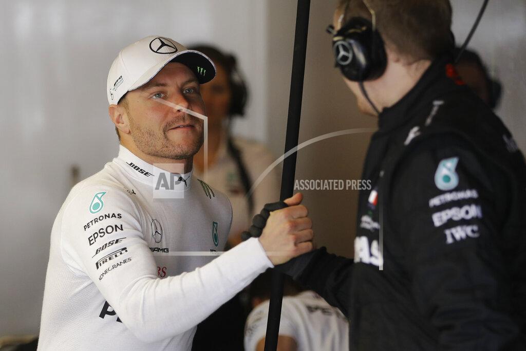 Darron Cummings Mercedes driver Valtteri Bottas, of Finland, is greeted in the team's garage before the qualifying session for the Formula One U.S. Grand Prix auto race at the Circuit of the Americas, Saturday, Nov. 2, 2019, in Austin, Texas. (AP Photo/Darron Cummings)
