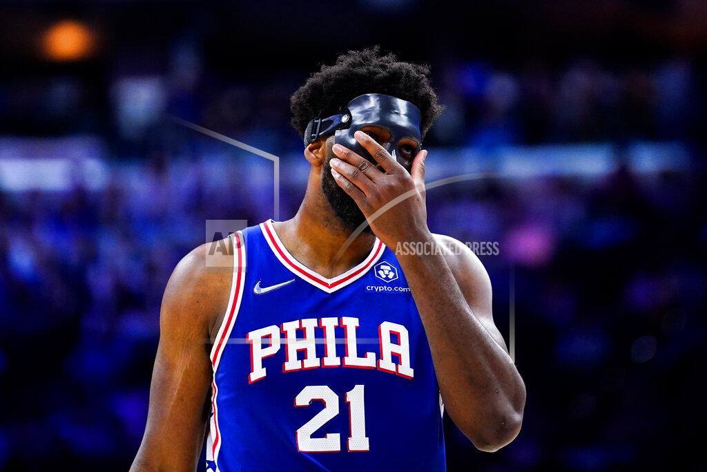 Matt Slocum Philadelphia 76ers' Joel Embiid adjusts his mask during the second half of Game 6 of an NBA basketball second-round playoff series against the Miami Heat, Thursday, May 12, 2022, in Philadelphia. (AP Photo/Matt Slocum)