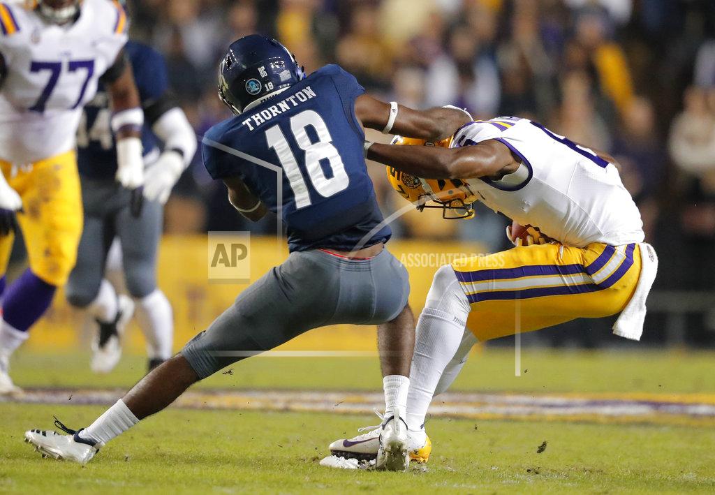 Gerald Herbert LSU wide receiver Terrace Marshall Jr. eludes a tackle by Rice defensive back Tyrae Thornton (18) on a pass reception in the first half of an NCAA college football game in Baton Rouge, La., Saturday, Nov. 17, 2018. (AP Photo/Gerald Herbert)