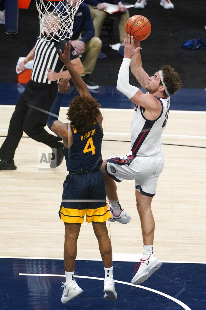Darron Cummings Gonzaga's Corey Kispert (24) shoots against West Virginia's Miles McBride (4) during the second half of an NCAA college basketball game Wednesday, Dec. 2, 2020, in Indianapolis. (AP Photo/Darron Cummings)