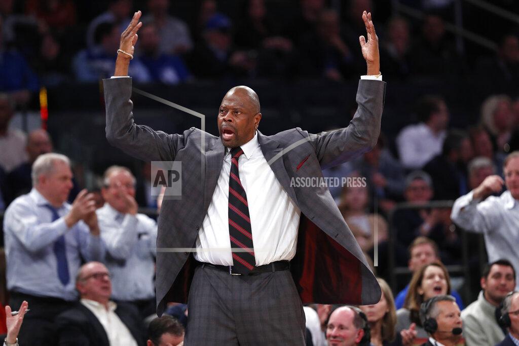 Kathy Willens Georgetown head coach Patrick Ewing encourages the crowd to get behind his team during the second half of the first round of the 2K Empire Classic NCAA college basketball tournament against Texas, Thursday, Nov. 21, 2019, in New York. Georgetown defeated Texas 82-66. (AP Photo/Kathy Willens)