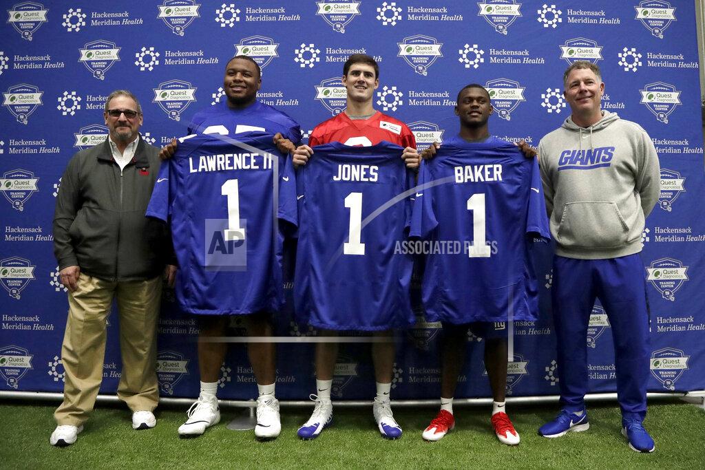 Julio Cortez New York Giants general manager Dave Gettleman, left, and head coach Pat Shurmur, right, pose for photographers with the team's first round draft picks, from left, Dexter Lawrence, 17th overall, Daniel Jones, 6th overall, and Deandre Baker, 30th overall, during NFL football rookie camp, Friday, May 3, 2019, in East Rutherford, N.J. (AP Photo/Julio Cortez)