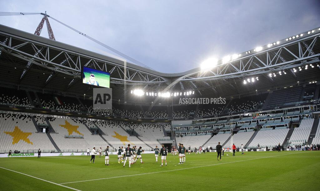 Luca Bruno Juventus players warm-up before an Italian Cup second leg soccer match between Juventus and AC Milan at the Allianz stadium, in Turin, Italy, Friday, June 12, 2020. The match was being played without spectators because of the coronavirus lockdown. (AP Photo/Luca Bruno)