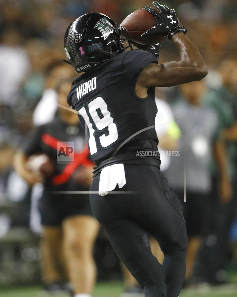 Marco Garcia Hawaii wide receiver JoJo Ward (19) makes a catch over Nevada during the third quarter at an NCAA college football game Saturday, Oct. 20, 2018, in Honolulu. (AP Photo/Marco Garcia)