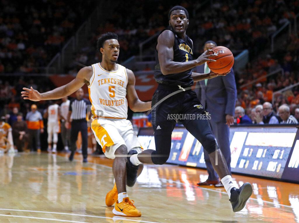 Wade Payne Alabama State guard Leon Daniels (1) catches an inbound pass as he's defended by Tennessee guard Josiah-Jordan James (5) during the first half of an NCAA college basketball game Wednesday, Nov. 20, 2019, in Knoxville, Tenn. (AP Photo/Wade Payne)