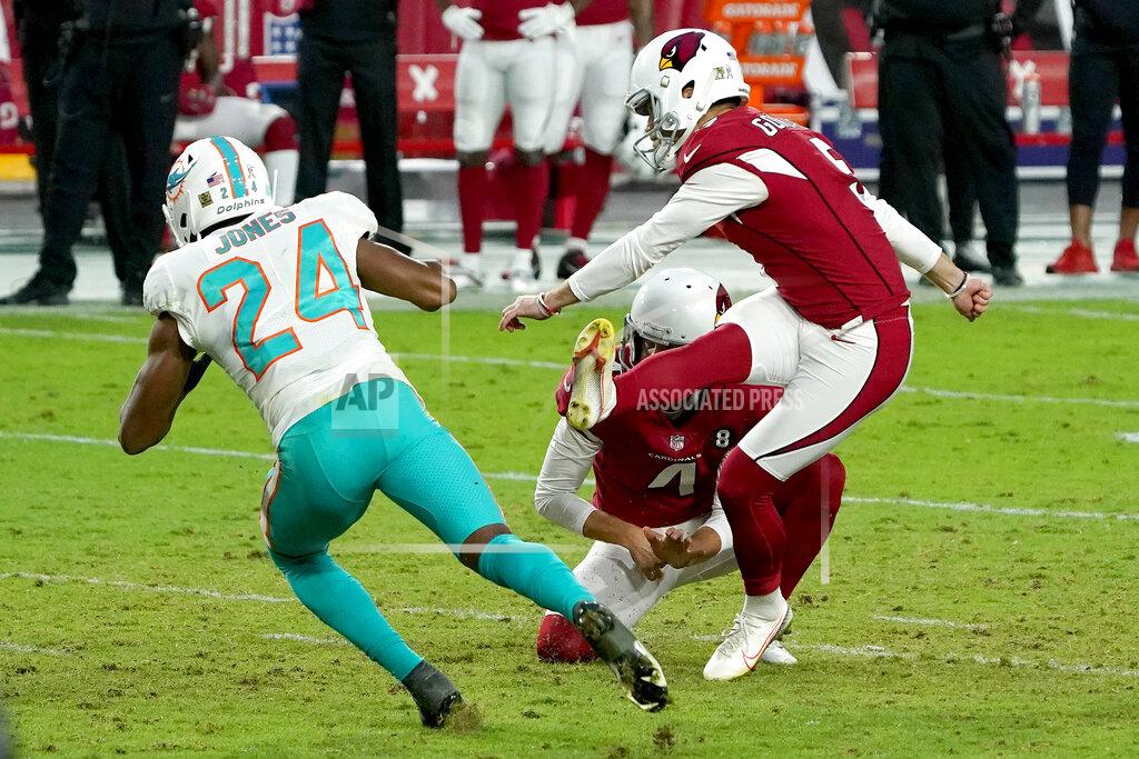 Rick Scuteri Arizona Cardinals kicker Zane Gonzalez unsuccessfully attempts a game-tying field goal as punter Andy Lee (4) holds during the second half of an NFL football game as Miami Dolphins cornerback Byron Jones (24) defends, Sunday, Nov. 8, 2020, in Glendale, Ariz. The Dolphins won 34-31. (AP Photo/Rick Scuteri)