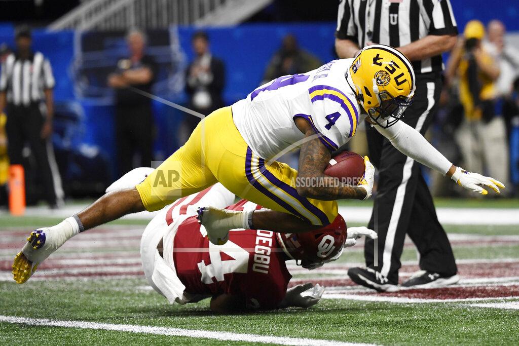 Danny Karnik LSU running back John Emery Jr. (4) scores a touchdown against Oklahoma during the second half of the Peach Bowl NCAA semifinal college football playoff game, Saturday, Dec. 28, 2019, in Atlanta. (AP Photo/Danny Karnik)