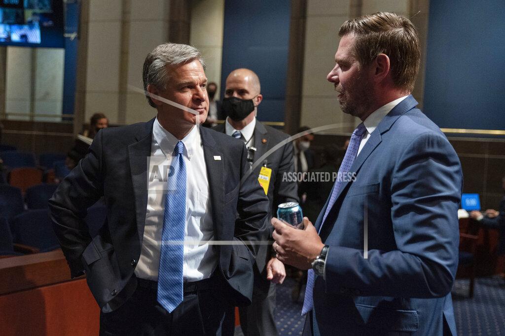 Manuel Balce Ceneta FBI Director Christopher Wray, left, and House Judiciary Committee member Rep. Eric Swalwell, D-Calif., talk during a recess of the committee's oversight hearing on the Federal Bureau of Investigation on Capitol Hill, Thursday, June 10, 2021, in Washington. (AP Photo/Manuel Balce Ceneta)
