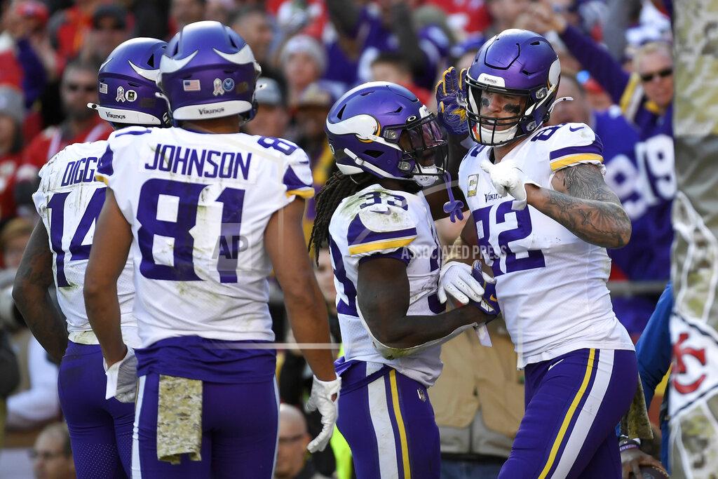Reed Hoffmann Minnesota Vikings tight end Kyle Rudolph (82) celebrates his touchdown with running back Dalvin Cook (33), wide receiver Bisi Johnson (81) and wide receiver Stefon Diggs (14) during the second half of an NFL football game against the Kansas City Chiefs in Kansas City, Mo., Sunday, Nov. 3, 2019. (AP Photo/Reed Hoffmann)