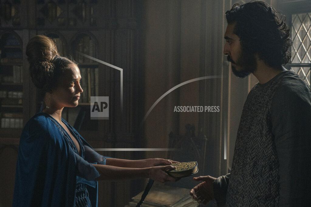 Eric Zachanowich This image released by A24 shows Alicia Vikander, left, and Dev Patel in a scene from "The Green Knight." (Eric Zachanowich/A24 Films via AP)