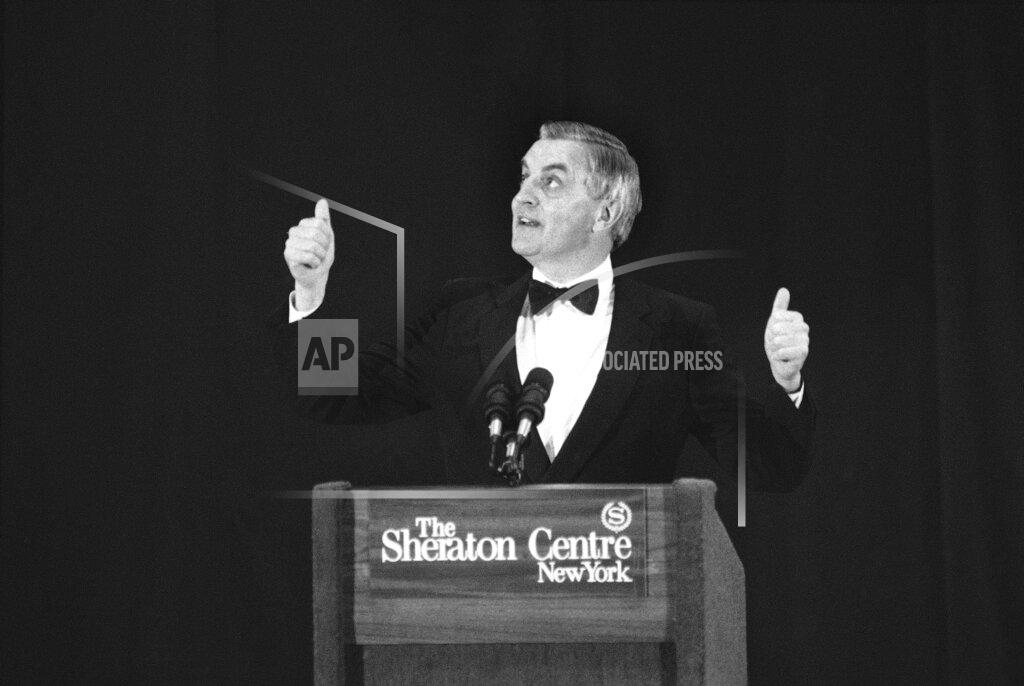 Richard Drew FILE - In this Wednesday, Oct. 11, 1984, file photo, presidential candidate Walter Mondale gestures while speaking at a Democratic fundraising dinner, in New York. Mondale, a liberal icon who lost the most lopsided presidential election after bluntly telling voters to expect a tax increase if he won, died Monday, April 19, 2021. He was 93. (AP Photo/Richard Drew, File)