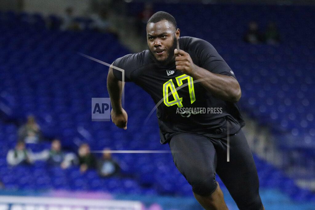 FILE - In this Feb. 28, 2020, file photo, Georgia offensive lineman Andrew Thomas runs a drill at the NFL football scouting combine in Indianapolis. The Giants drafted tackle Andrew Thomas of Georgia with the fourth pick overall in the recent draft. He probably will replace Nate Solder, who opted out of the 2020 NFL season because of the coronavirus pandemic. (AP Photo/Michael Conroy, File)