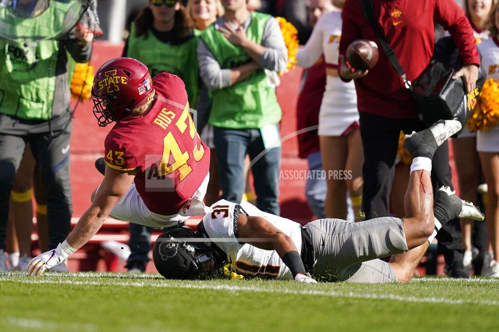 Charlie Neibergall Iowa State tight end Jared Rus (43) is tackled by Oklahoma State safety Kolby Harvell-Peel (31) after catching a pass during the first half of an NCAA college football game, Saturday, Oct. 23, 2021, in Ames, Iowa. (AP Photo/Charlie Neibergall)