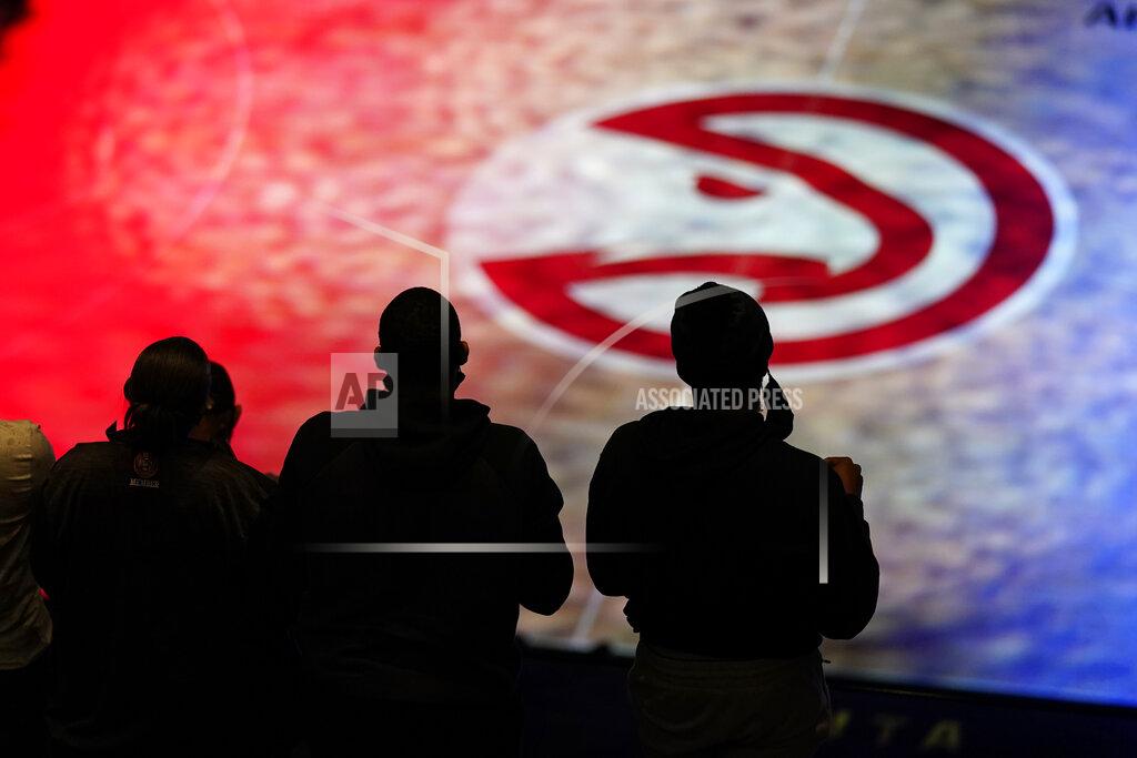 John Bazemore Atlanta Hawks fans stand for the national anthem before an NBA basketball game against the Philadelphia 76ers, Monday, Jan. 11, 2021, in Atlanta. (AP Photo/John Bazemore)