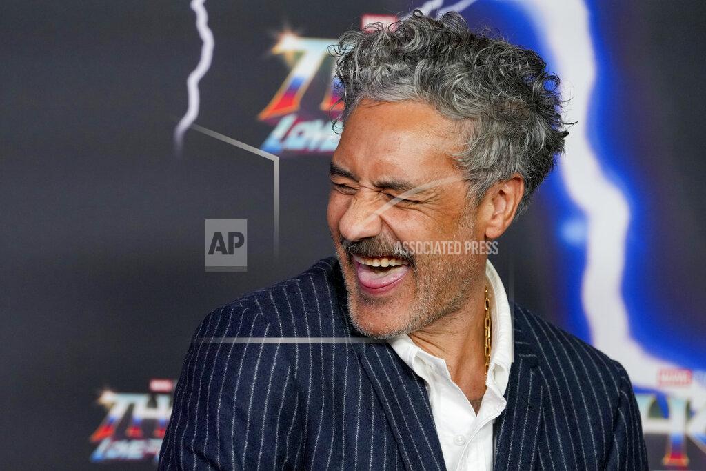 Mark Baker New Zealand director Taika Waititi reacts as he poses for a photo during a red carpet event for the movie premiere of "Thor: Love and Thunder" at the Entertainment Quarter in Sydney,Australia, Monday, June 27, 2022.(AP Photo/Mark Baker)