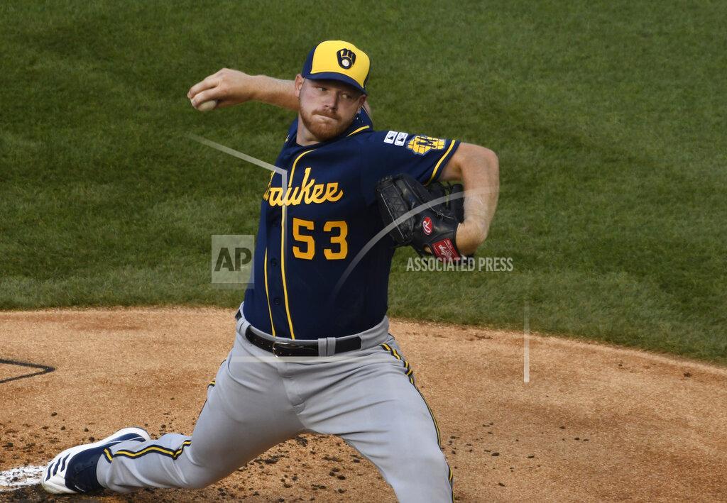 David Banks Milwaukee Brewers starting pitcher Brandon Woodruff (53) throws the ball against the Chicago Cubs during the first inning of an opening day baseball game Friday, July, 24, 2020, in Chicago. (AP Photo/David Banks)