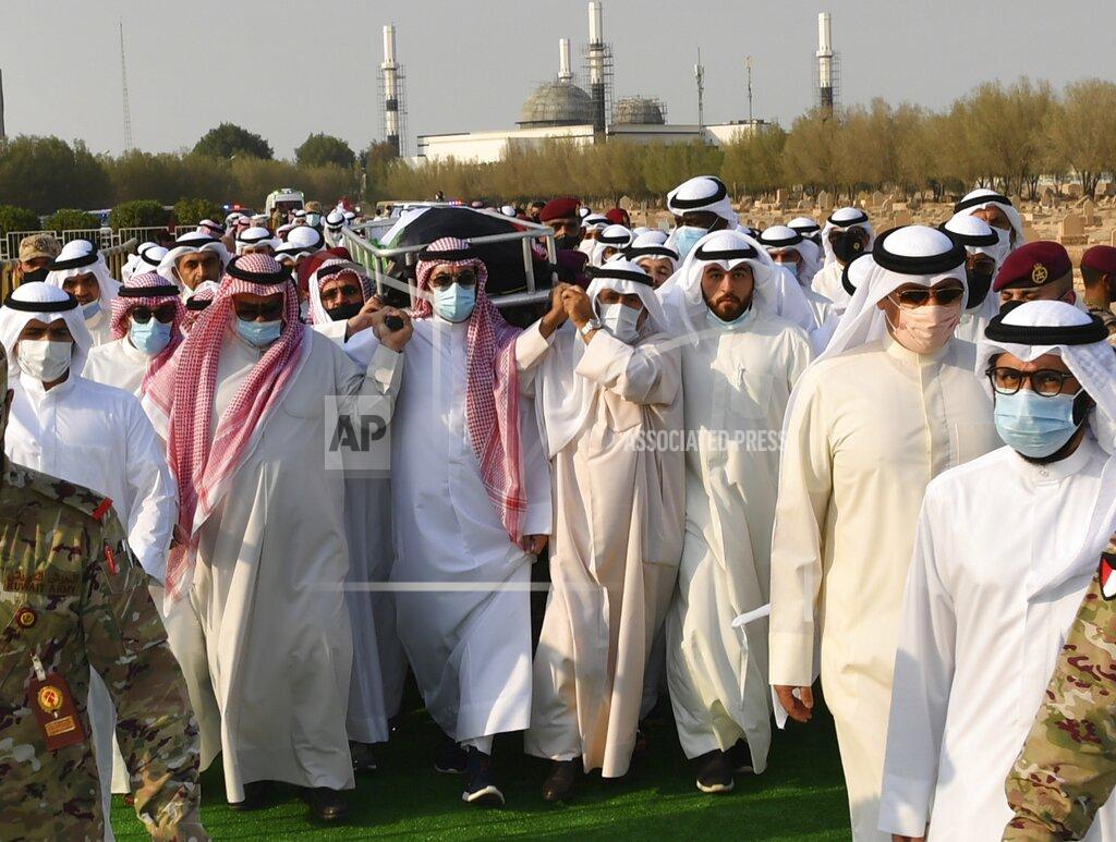 Uncredited In this photo released by Diwan Al Amiri, the body of the late Emir of Kuwait Sheikh Sabah Al Ahmad Al Sabah is carried during his funeral ceremony in Kuwait, Wednesday, Sept. 30, 2020. The late Emir drew on his decades as the oil-rich nation’s top diplomat to push for closer ties to Iraq after the 1990 Gulf War and solutions to other regional crises, died Tuesday, Sept. 29, 2020. He was 91. (Diwan Al Amiri via AP)
