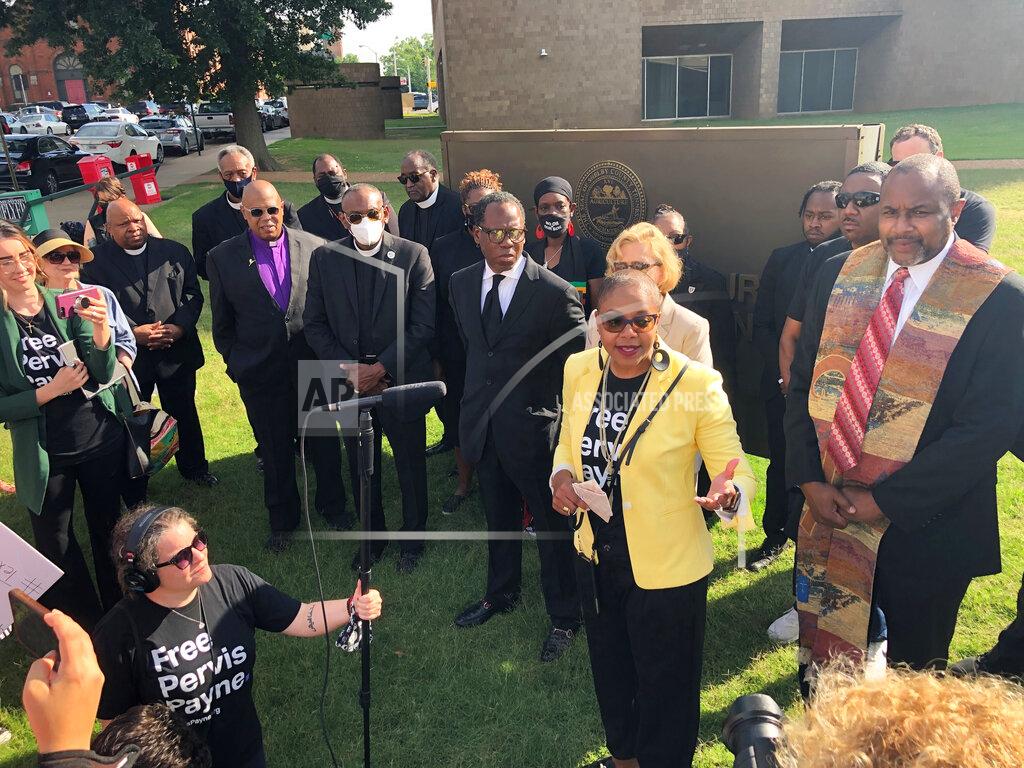 Adrian Sainz Rolanda Holman, center right, speaks during a prayer vigil for her brother, Tennessee death row inmate Pervis Payne, on Friday, June 4, 2021, in Memphis, Tenn. A judge ruled Friday that an expert hired by a state prosecutors' office can conduct a mental evaluation of Payne, who claims he is intellectually disabled and should not be executed. (AP Photo/Adrian Sainz)