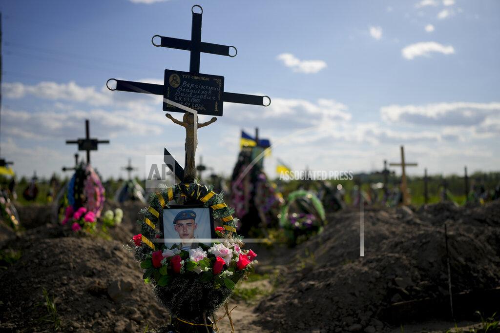 Natacha Pisarenko The tomb of a person who died after Russia invasion is seen in Bucha cemetery, outskirts of Kyiv, Ukraine, Tuesday, May 24, 2022. (AP Photo/Natacha Pisarenko)