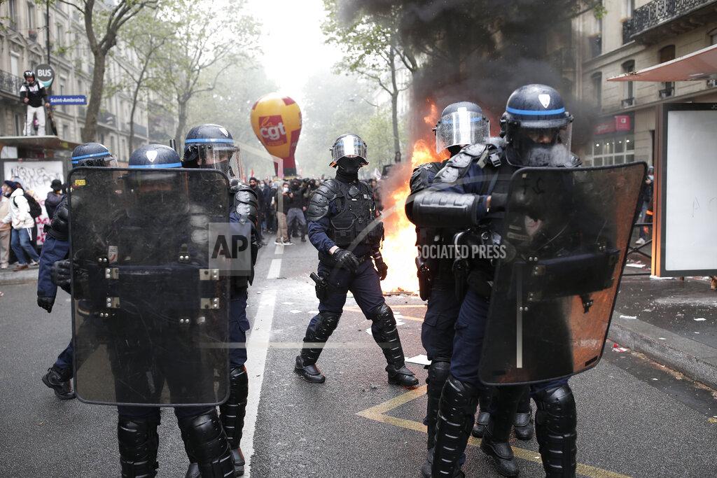 Lewis Joly Riot police officers face demonstrators during May Day march incidents Saturday, May 1, 2021 in Paris. Workers and union leaders dusted off bullhorns and flags that had stayed furled during coronavirus lockdowns for slimmed down but still boisterous May Day marches on Saturday, demanding more labor protections amid a pandemic that has turned economies and workplaces upside down. (AP Photo/Lewis Joly)