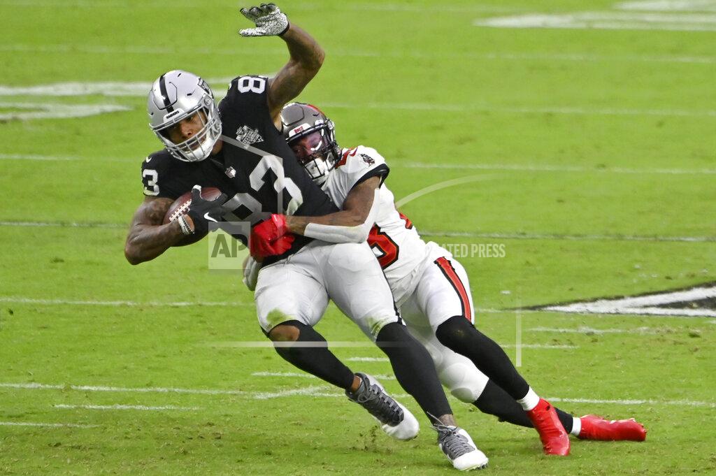 David Becker Tampa Bay Buccaneers cornerback Sean Murphy-Bunting (23) tackles Las Vegas Raiders tight end Darren Waller (83) during the second half of an NFL football game, Sunday, Oct. 25, 2020, in Las Vegas. (AP Photo/David Becker)