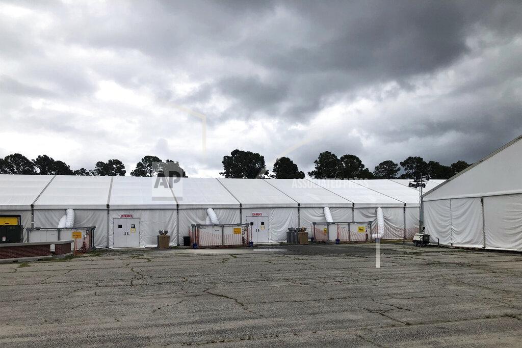 Lolita Baldor Quarantine tents set up for recruits arriving at the Marine Corps' Parris Island Recruit Depot, S.C., on May 27, 2020. The tents were used until earlier this week and now recruits go through quarantine at the Citadel, the Marine college in Charleston, S.C. In ways big and small, the virus is impacting training at the Marine Corps' Parris Island Recruit Depot and across the military. (AP Photo/Lolita Baldor)