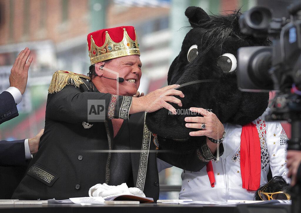 Jim Weber Memphis wrestler Jerry Lawler reacts as ESPN's "College GameDay" host Lee Corso dons the mascot head of SMU, picking the Mustangs over the Tigers for Saturday night's matchup between the two nationally ranked AAC teams, during the ESPN's "College GameDay," Saturday, Nov. 2, 2019, on Beale Street in Memphis, Tenn. (Jim Weber/Daily Memphian via AP)