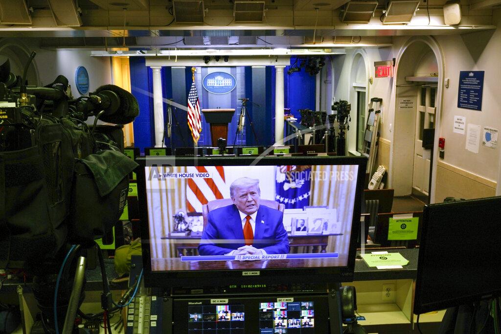 Gerald Herbert A video released by the White House, President Donald Trump shows a Twitter video on a television monitor in an empty press briefing room at the White House in Washington, after the U.S. House impeached him, Wednesday, Jan. 13, 2021. The pre-recorded video was being broadcast by Fox News. (AP Photo/Gerald Herbert )