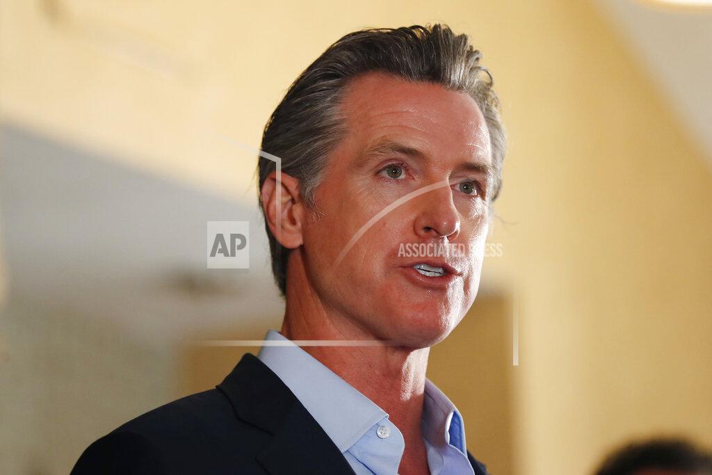 K.c. Alfred FILE - In this Tuesday, May 11, 2021, file photo, California Gov. Gavin Newsom speaks at a news conference at the Kearney Vista Apartments in San Diego, about a $12 billion package bolstering the state's response to the homelessness crisis. A fading coronavirus crisis and an astounding windfall of tax dollars have reshuffled California's emerging recall election, allowing Democratic Gov. Newsom to talk of a mask-free future and propose billions in new spending for schools and businesses as he looks to fend off Republicans who depict him as a foppish failure. (K.C. Alfred/The San Diego Union-Tribune via AP, File)