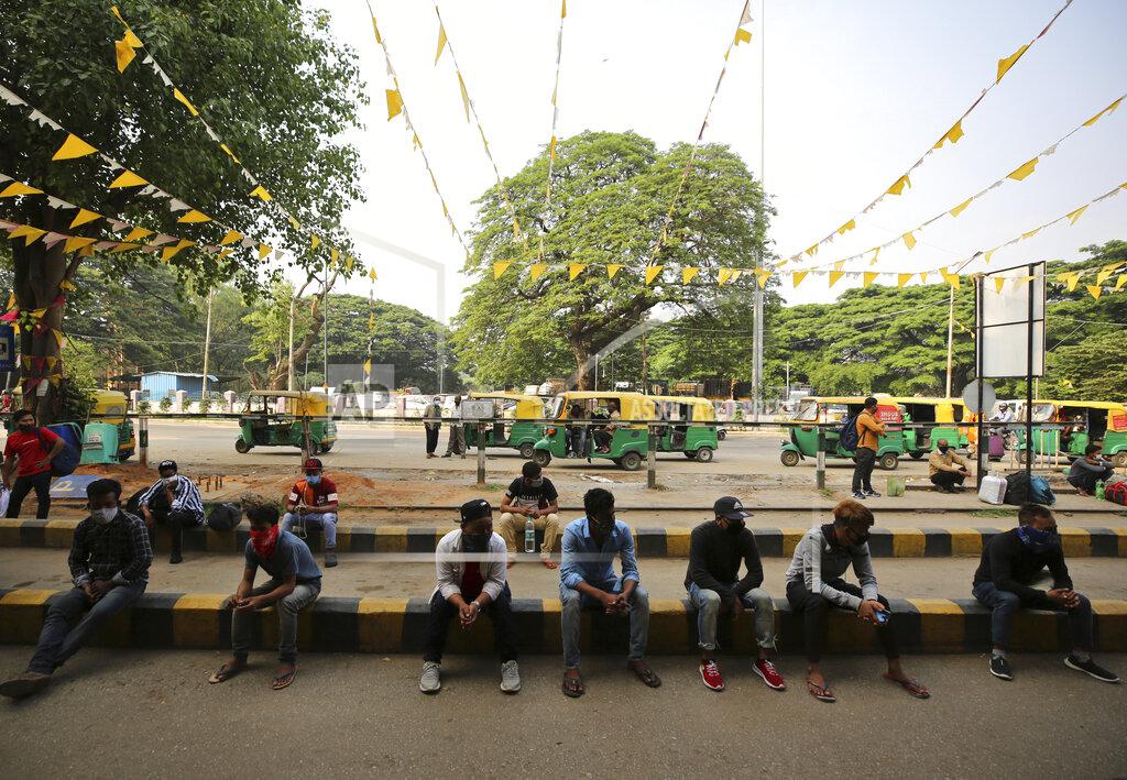 Aijaz Rahi Travelers wait for outstation trains after authorities imposed a two-week lockdown to curb the rising number of COVID-19 cases in Bengaluru, India, Wednesday, April 28, 2021. India, a country of nearly 1.4 billion people, Wednesday became the fourth nation to cross 200,000 deaths. (AP Photo/Aijaz Rahi)