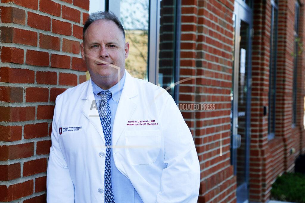 Jay Laprete Dr. Michael Cackovic, an OB/GYN who works at Ohio State University’s Wexner Medical Center, stands outside the Ohio State Outpatient Care facility Friday, April 23, 2021, in Upper Arlington, Ohio. When Republican lawmakers across the U.S. kept passing bans on abortion at what they term “the first detectable fetal heartbeat,” he was exasperated. Yet bans pegged to the “fetal heartbeat” concept have been signed into law in 12 states, including Cackovic’s home state of Ohio, with another awaiting a governor’s signature. (AP Photo/Jay LaPrete)