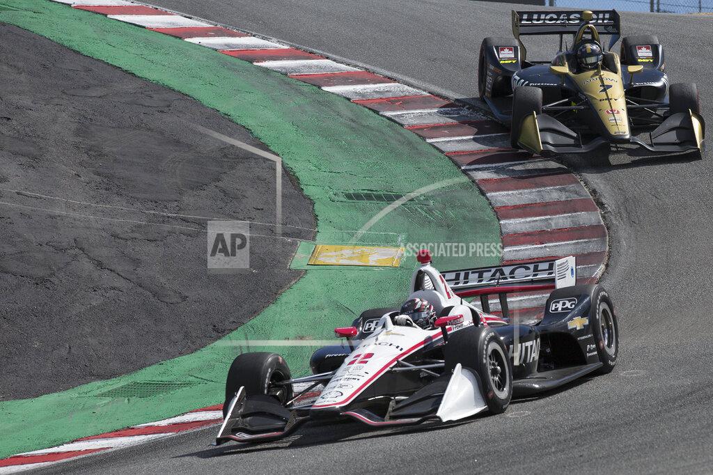 David Royal Josef Newgarden (2) leads Marcus Ericsson (7) down The Corkscrew during an IndyCar auto race at Laguna Seca Raceway in Monterey, Calif., Sunday, Sept. 22, 2019. (AP Photo/David Royal)