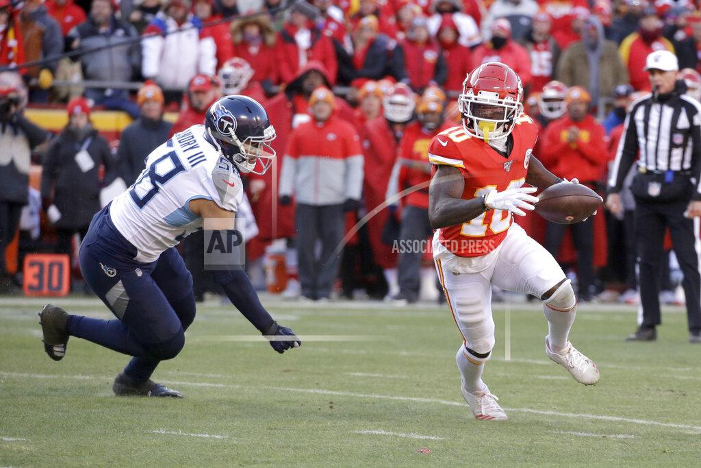 Charlie Riedel Kansas City Chiefs wide receiver Tyreek Hill (10) runs away from Tennessee Titans linebacker Harold Landry III (58) during the first half of the NFL AFC Championship football game Sunday, Jan. 19, 2020, in Kansas City, MO. (AP Photo/Charlie Riedel)