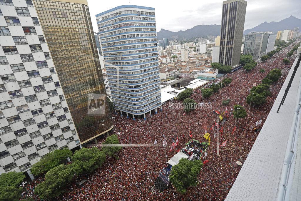 Silvia Izquierdo Players of Brazil's Flamengo parade down the street at their arrival in Rio de Janeiro, Brazil, Nov. 24, 2019. Flamengo overcame Argentina's River Plate 2-1 in the Copa Libertadores final match in Lima to win its second South American title. (AP Photo/Silvia Izquierdo)