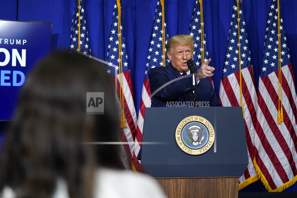 Evan Vucci President Donald Trump speaks during a coronavirus briefing at Bioprocess Innovation Center at Fujifilm Diosynth Biotechnologies, Monday, July 27, 2020, in Morrisville, N.C. (AP Photo/Evan Vucci)