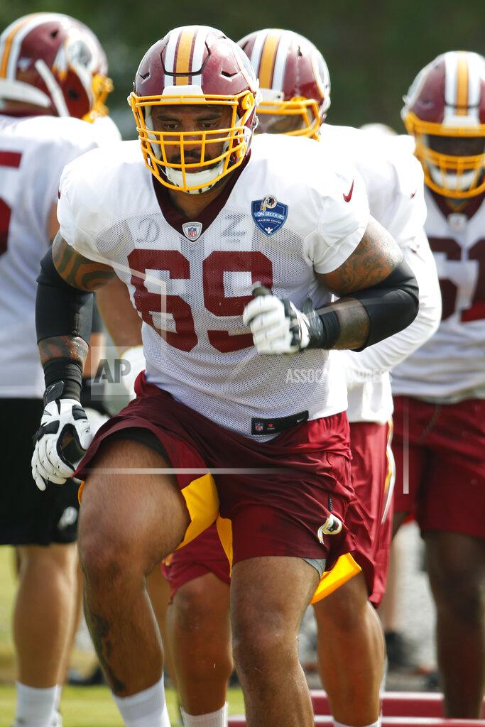 FILE - In this July 31, 2019, file photo, Washington Redskins offensive lineman Hugh Thornton (69) runs drills during NFL football training camp in Richmond, Va. Now 27 months removed from a painful decision similar to what former teammate Andrew Luck made last week, Thornton is attempting to complete an NFL comeback with the Redskins that would be a major milestone in a lifelong journey full of adversity. (AP Photo/Steve Helber, File)