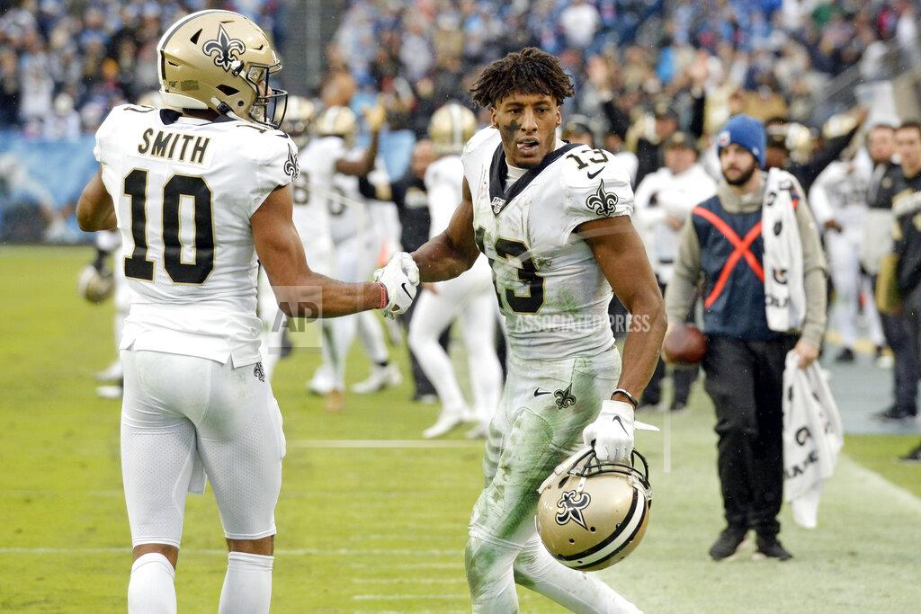 Mark Zaleski New Orleans Saints wide receiver Michael Thomas (13) is congratulated by Tre'Quan Smith (10) after Thomas made a catch against the Tennessee Titans in the second half of an NFL football game Sunday, Dec. 22, 2019, in Nashville, Tenn. The catch gave Thomas the NFL single-season pass reception record. (AP Photo/Mark Zaleski)