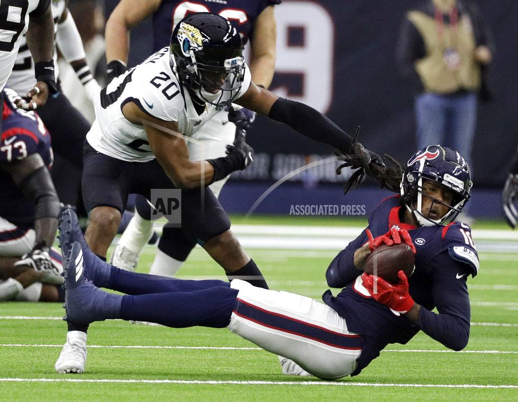 David J. Phillip Houston Texans wide receiver DeAndre Hopkins (10) pulls in a pass in front of Jacksonville Jaguars cornerback Jalen Ramsey (20) during the second half of an NFL football game, Sunday, Dec. 30, 2018, in Houston. (AP Photo/David J. Phillip)
