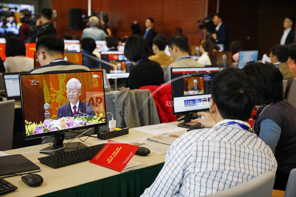 Minh Hoang Journalists, sitting at the media center, watch Nguyen Phu Trong, General Secretary of the Communist Party of Vietnam delivering a speech, on screens, during the opening ceremony of the 13th National Congress of Vietnam's Communist Party (VCP), in Hanoi, Vietnam on Tuesday, Jan. 26, 2021. Vietnam's ruling Communist Party has begun a crucial weeklong meeting in the capital Hanoi to set the nation's path for the next five years and appoint the country's top leaders. (AP Photo/Minh Hoang)