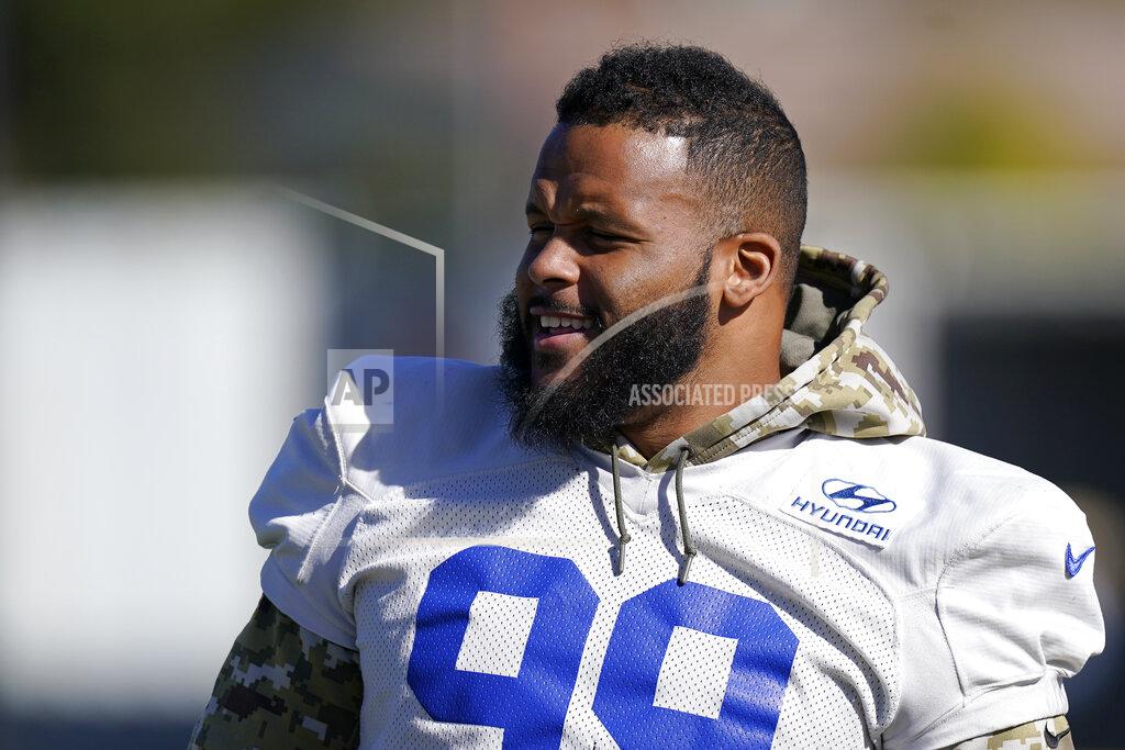 Mark J. Terrill Los Angeles Rams defensive end Aaron Donald stands on the field during an NFL football practice Friday, Jan. 28, 2022, in Thousand Oaks, Calif., ahead of the NFC championship game against the San Francisco 49ers on Sunday. (AP Photo/Mark J. Terrill)