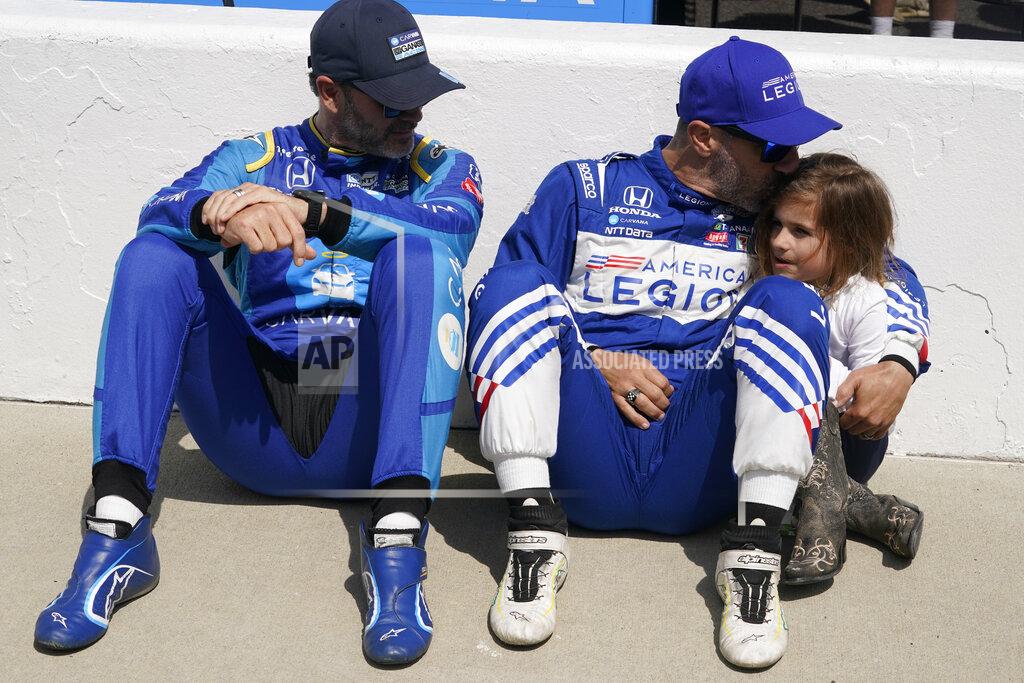 Darron Cummings Alex Palou, center, of Spain, hugs Sofia Franchitti, right, as Jimmie Johnson, left, watches before qualifications for the Indianapolis 500 auto race at Indianapolis Motor Speedway, Sunday, May 22, 2022, in Indianapolis. (AP Photo/Darron Cummings)