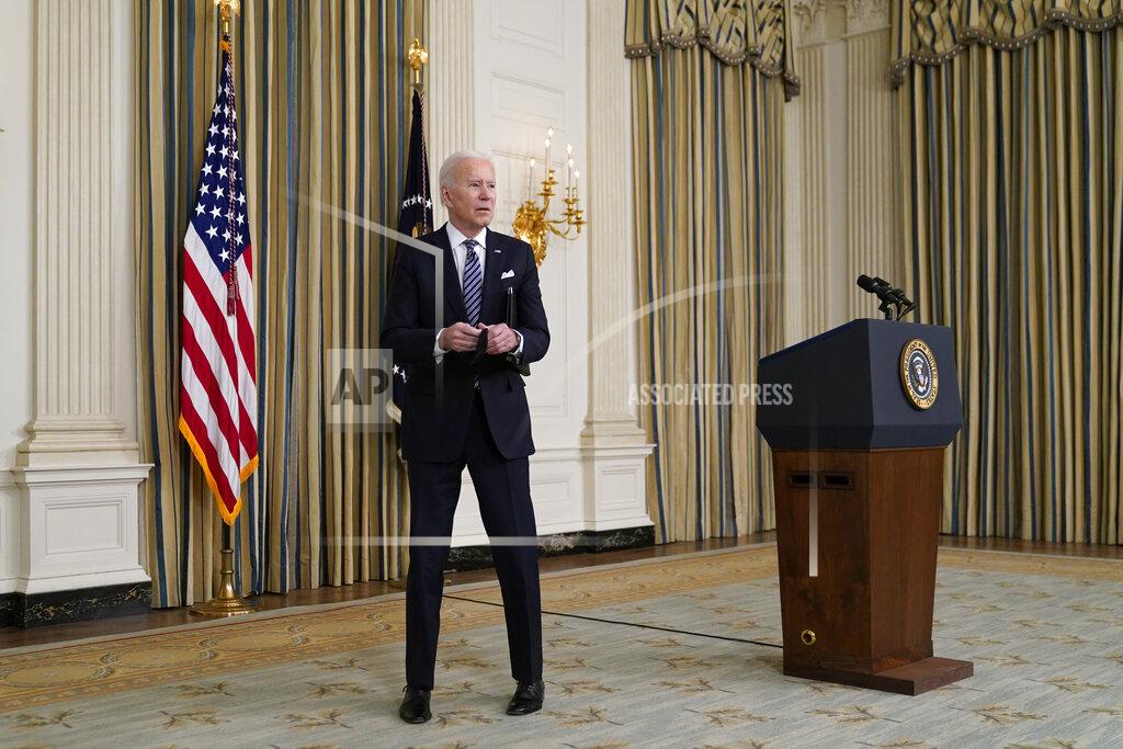 Patrick Semansky President Joe Biden stops to listen to a reporter's question after speaking about the COVID-19 relief package in the State Dining Room of the White House, Monday, March 15, 2021, in Washington. (AP Photo/Patrick Semansky)