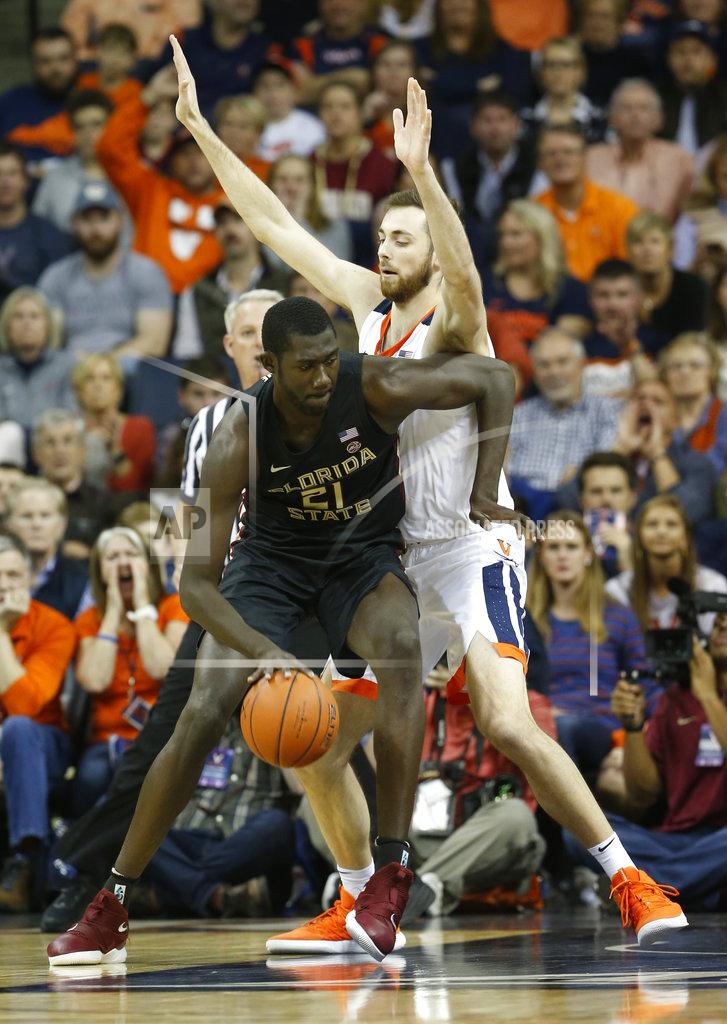 Steve Helber Florida State center Christ Koumadje (21) tries to get around Virginia forward Jay Huff (30) during the first half of an NCAA college basketball game in Charlottesville, Va., Saturday, Jan. 5, 2019. (AP Photo/Steve Helber)